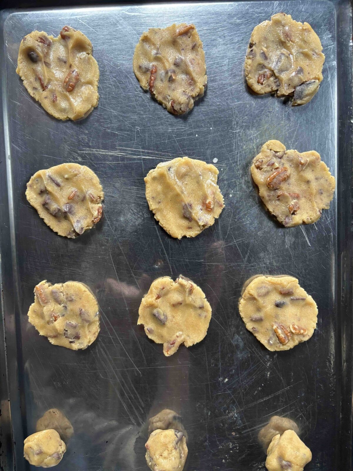 chocolate chip cookie dough on sheet pan