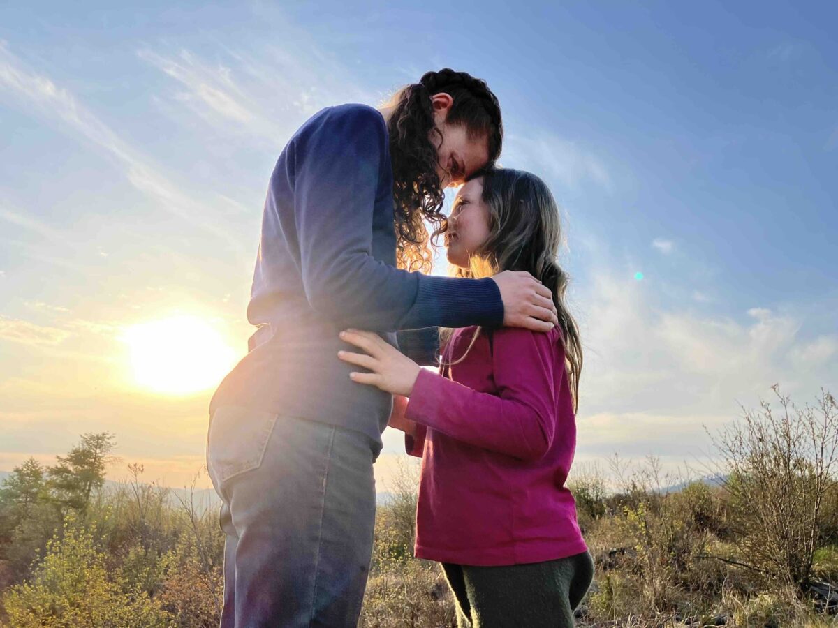 Rose and daughter at sunset